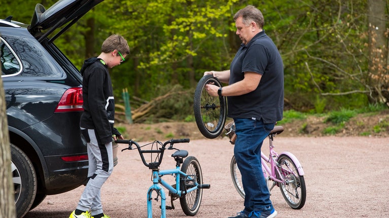 Family getting ready for a bike ride in comer woods dudmaston shropshire